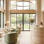 Modern med spa lobby with natural light, neutral tones, and a calm luxury waiting area