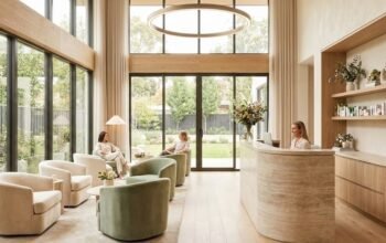 Modern med spa lobby with natural light, neutral tones, and a calm luxury waiting area